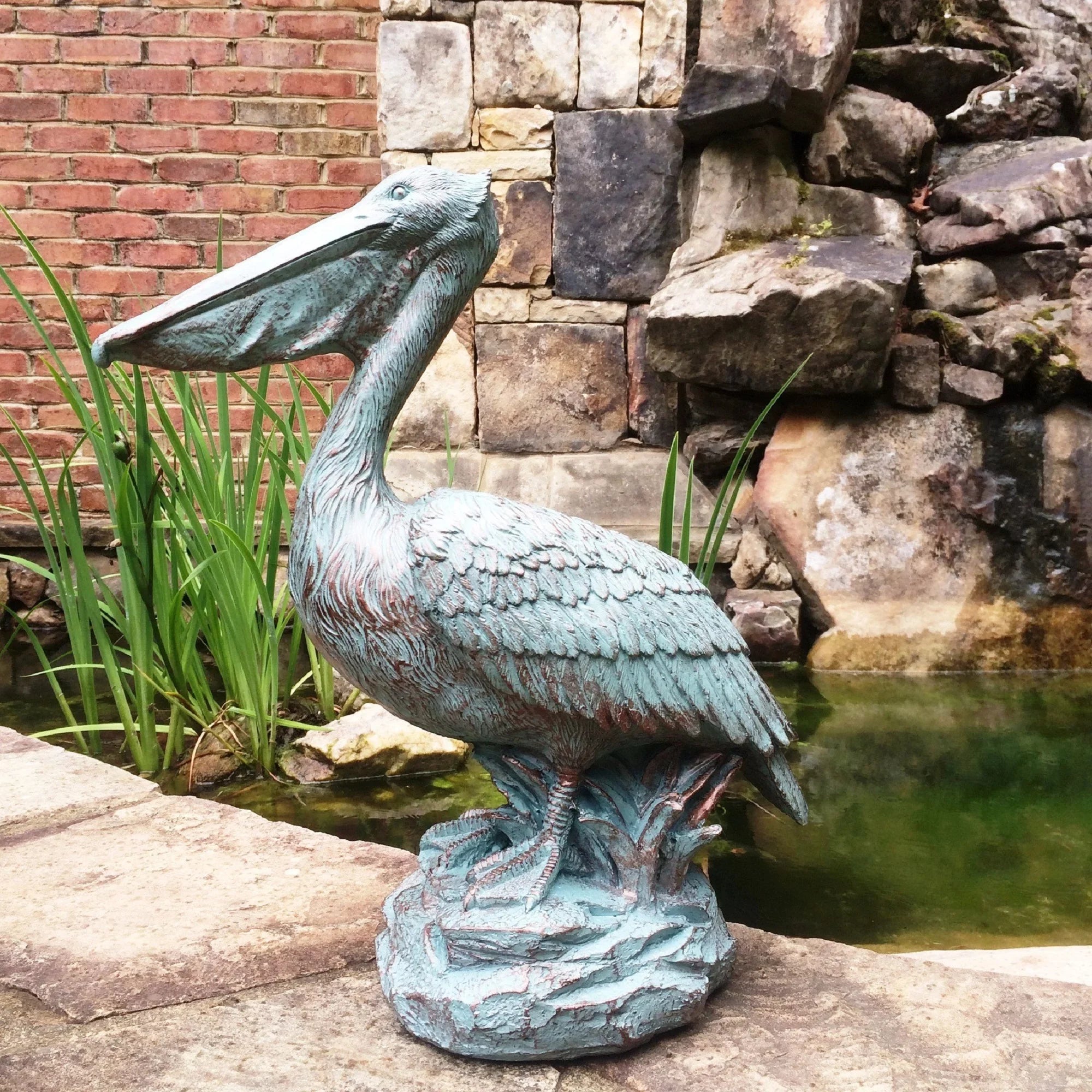 Homestyles 20 in. Bronze Patina Pelican on Coastal Rock Nautical Beach Statue